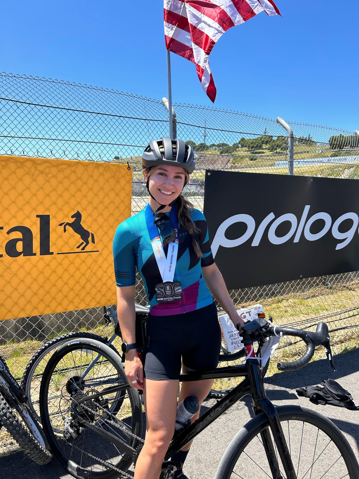 Juliet at a cycling event with her bike